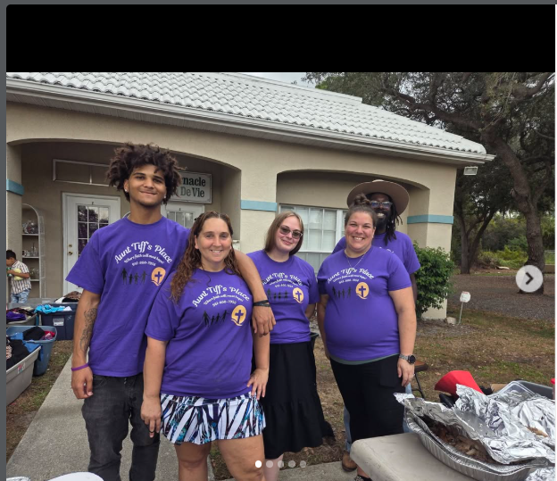 Aunt Tiff's Place community team wearing purple shirts